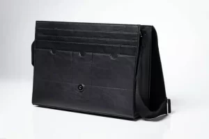 Black leather laptop bag with shoulder strap.