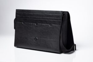 Black leather briefcase with shoulder strap.