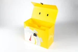 Yellow box with open lid and design.