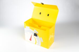 Yellow box with stopwatch design, open lid.