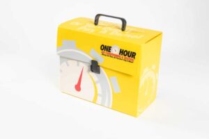 Yellow box with clock design and handle.