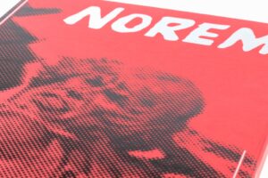 Red book cover with pixelated design.