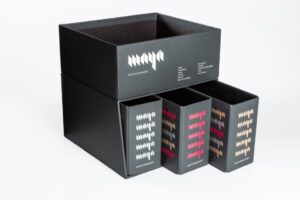 Black storage boxes with colorful geometric patterns.