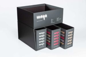 Black packaging boxes with colorful logo design.