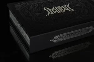 Black book with ornate embossed cover design.