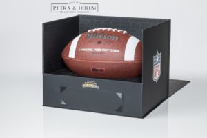 NFL football in presentation box.