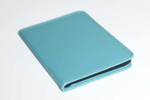 Teal leather binder on white background.