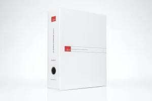 White binder with red label and text.
