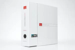 White binder with red and black accents.