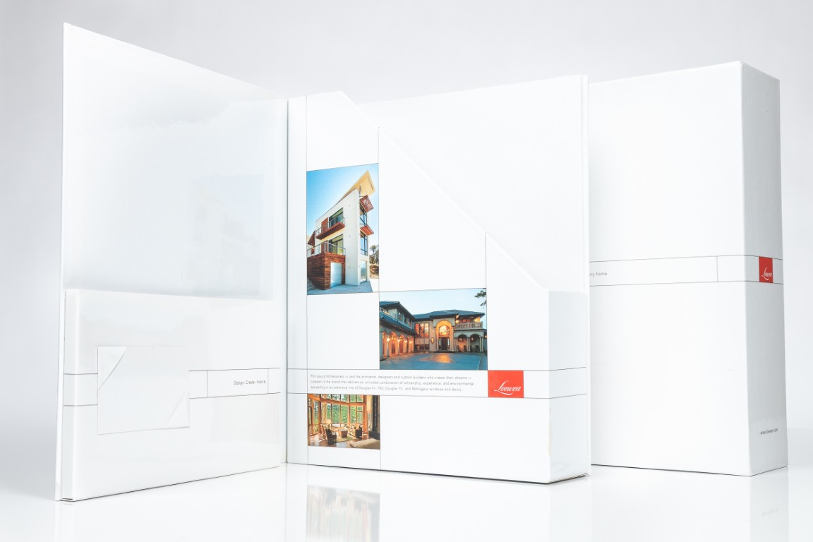 White promotional folder with architectural images displayed.