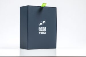 Dark box with green tab, promotional text.