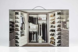 Walk-in closet with organized clothes and shoes.