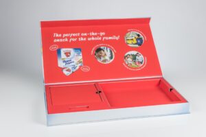 Snack packaging box with promotional text inside.