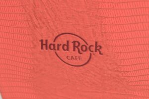 Red textured surface with Hard Rock Cafe logo.