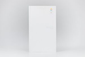 Plain white book on a light background.