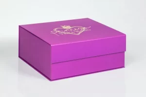 Purple gift box with golden heart design.