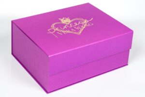 Pink gift box with gold lettering.