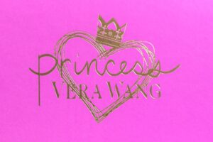 Pink Vera Wang Princess logo with crown.