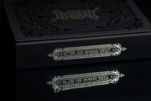 Decorative box with intricate silver design.