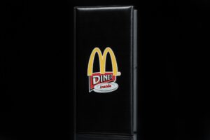 Black menu with yellow "M" logo.