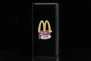 Black menu with diner logo on front.