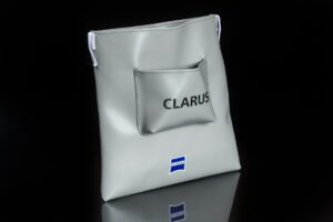 Gray bag with "CLARUS" and logo.