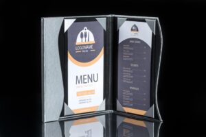 Restaurant menu displayed in a standing holder.