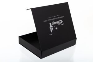 Black designer box with open lid.