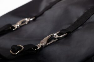 Black bag with metal clasps and straps.