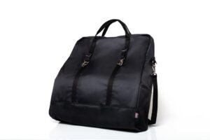 Black travel bag with handles and straps.