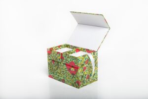 Decorative box with floral pattern and open lid.