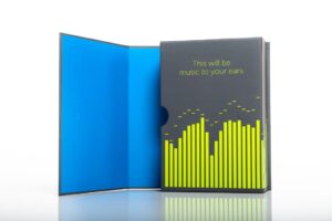 Music-themed packaging with blue interior.