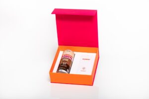 Open gift box with energy shot inside.