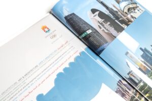 Open magazine showing buildings and text.