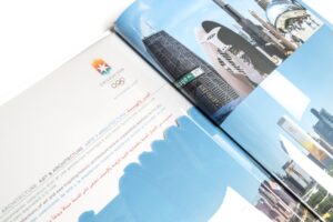 Open book with architectural illustrations and text.