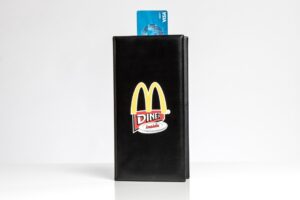 Credit card in a McDonald's menu holder.