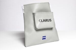 Gray bag with "CLARUS" and logo.