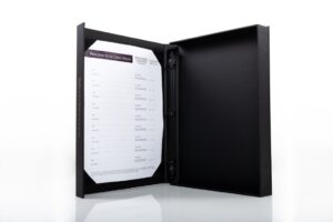 Binder with open cover and inserted paper.