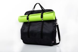 Black bag with green yoga mat attached.
