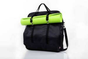 Black bag with green yoga mat attached.
