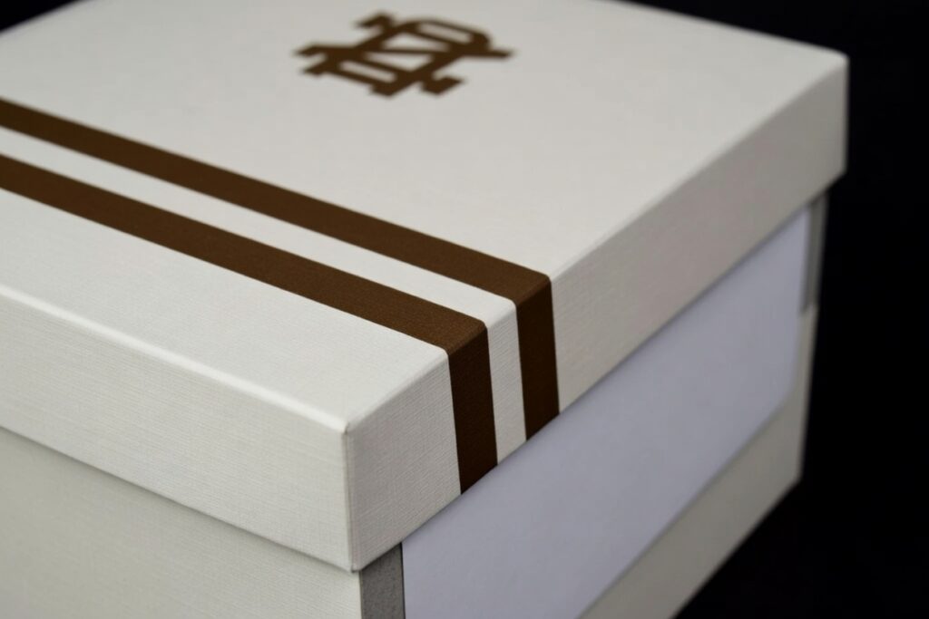 Luxury rigid box with turned-edge construction and premium wrap – custom packaging by Petra and Holum Chicago